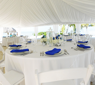 wedding tables under a white tent