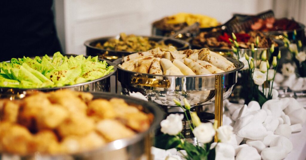 An assortment of dishes served buffet-style in a catered event.