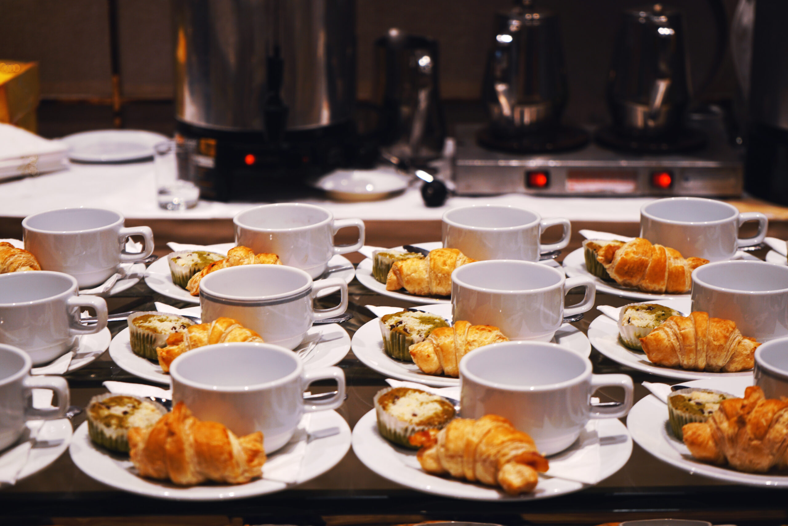 Bakery and beverage on white cup and dish for coffee break time at party, conference or seminar business.