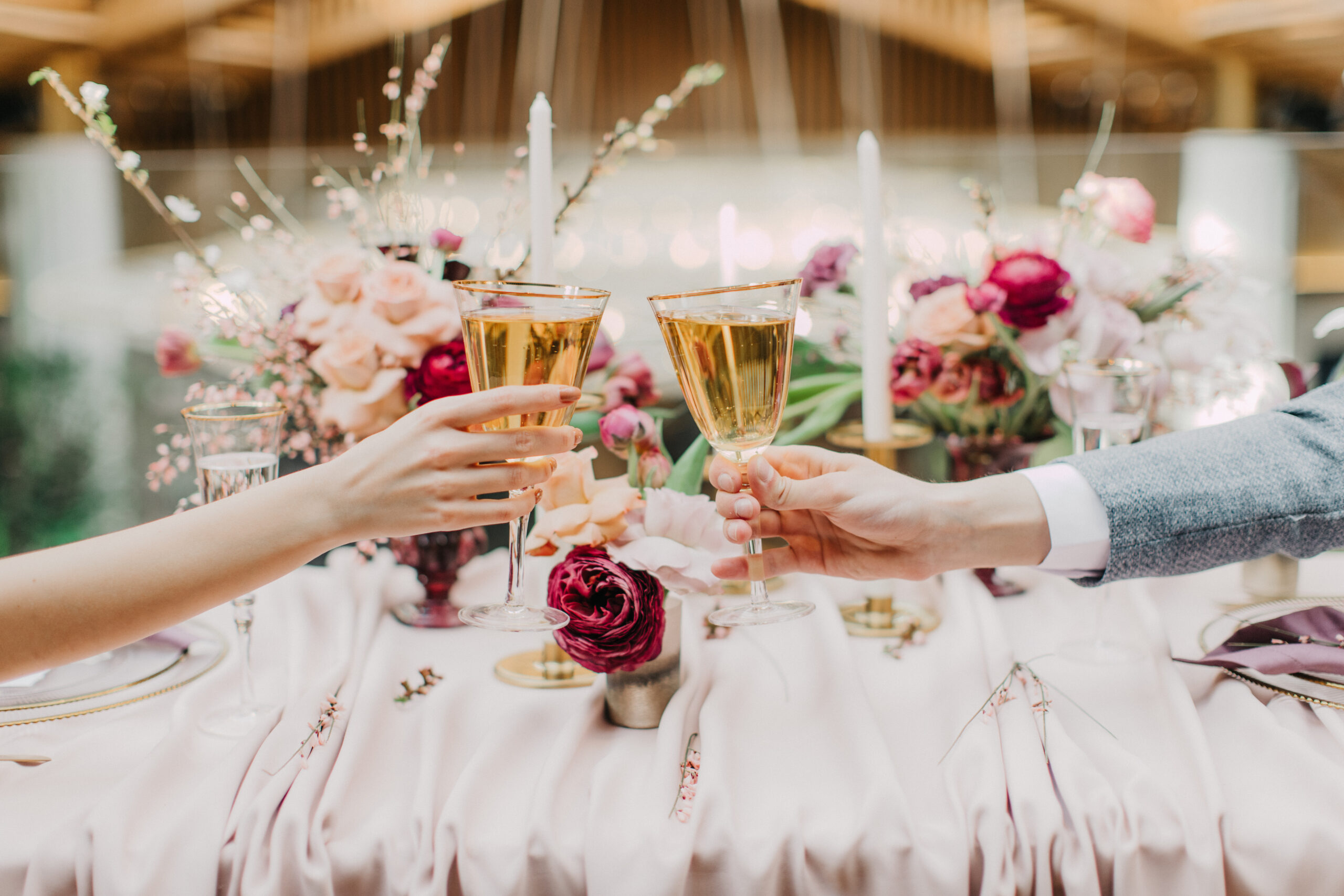 toasting glasses at wedding
